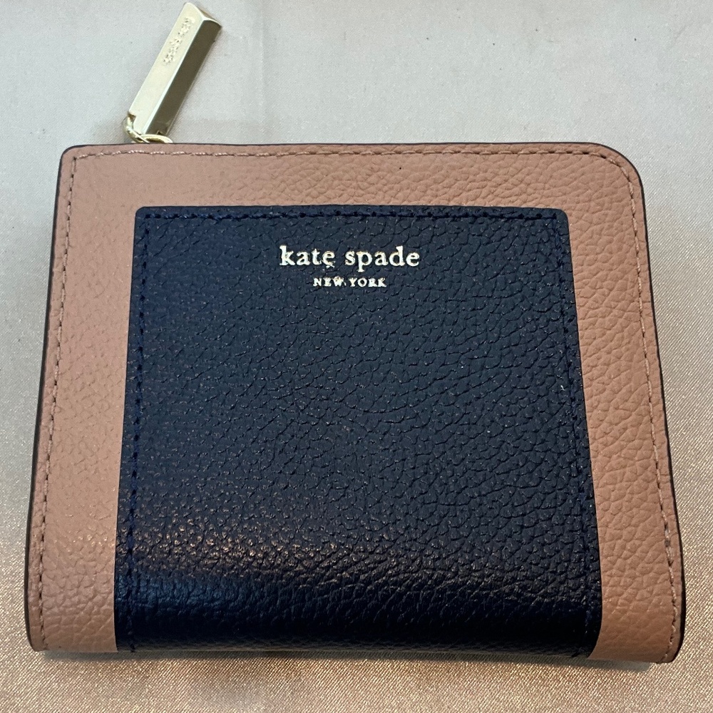 Kate Spade black and tan leather wallet.   9-H7B